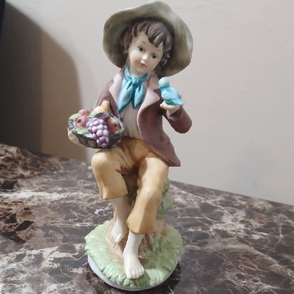 Vintage 1970s Porcelain Figurine of a Boy Holding a Fruit Basket and Blue Bird